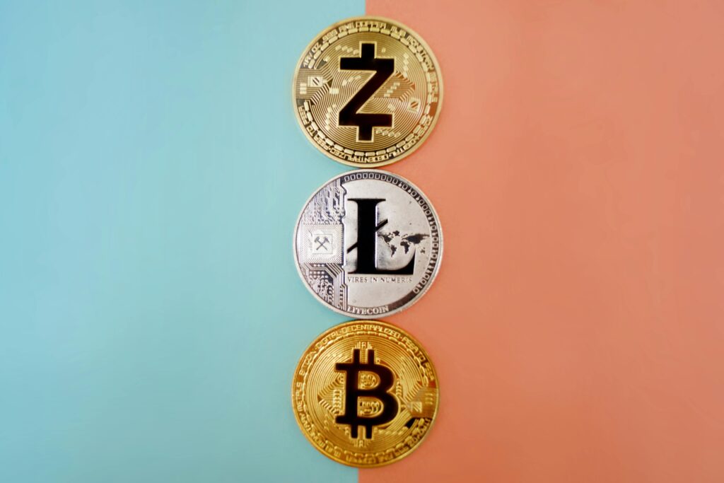Gold or Silver metapor with Colorful display of Zcash, Litecoin, and Bitcoin coins on gradient background.